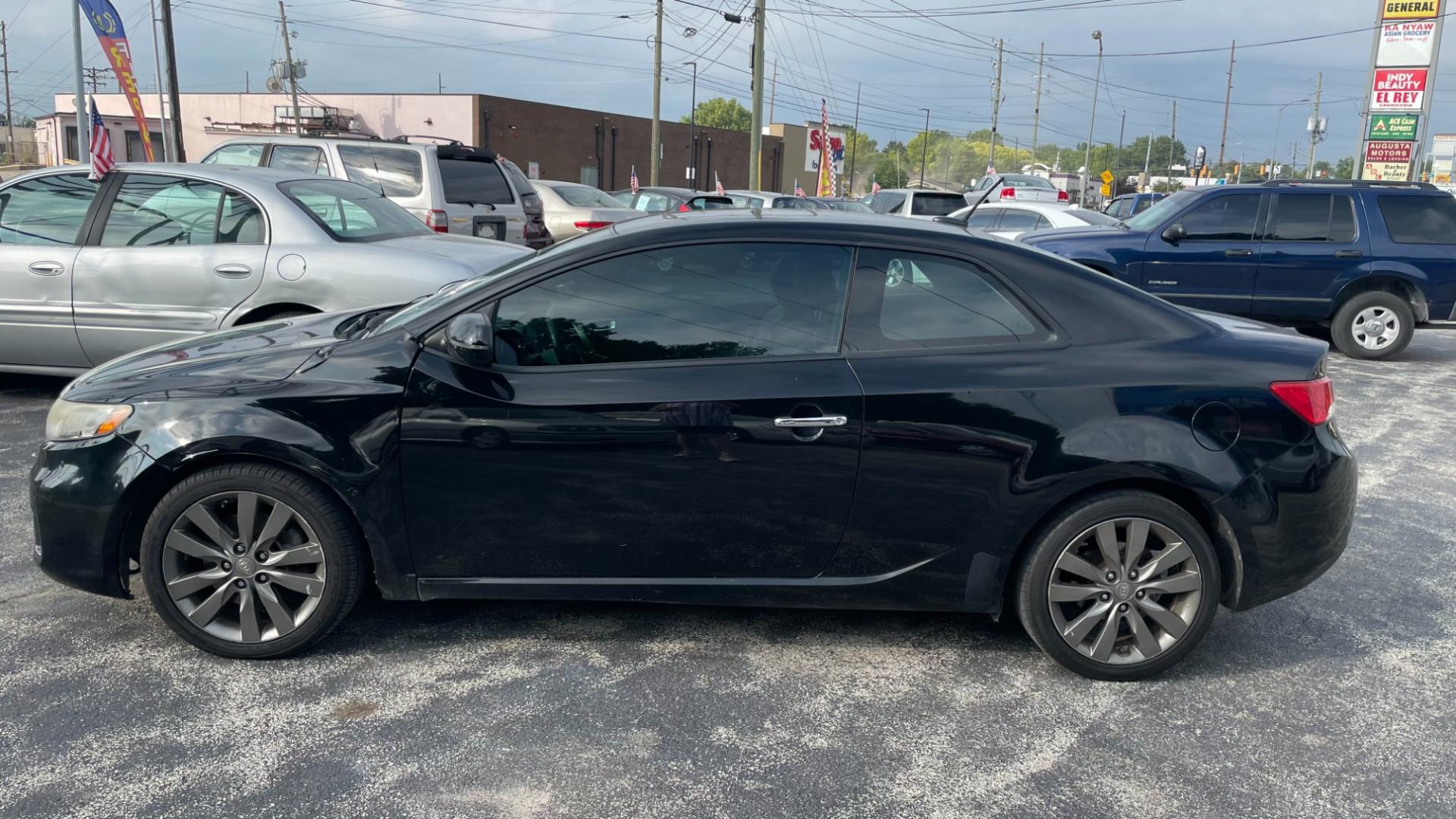 2011 /BLACK Kia Forte Koup SX (KNAFW6A36B5) with an 2.4L L4 DOHC 16V engine, located at 2710A Westlane Rd., Indianapolis, IN, 46268, (317) 291-2000, 39.885670, -86.208160 - Photo#1