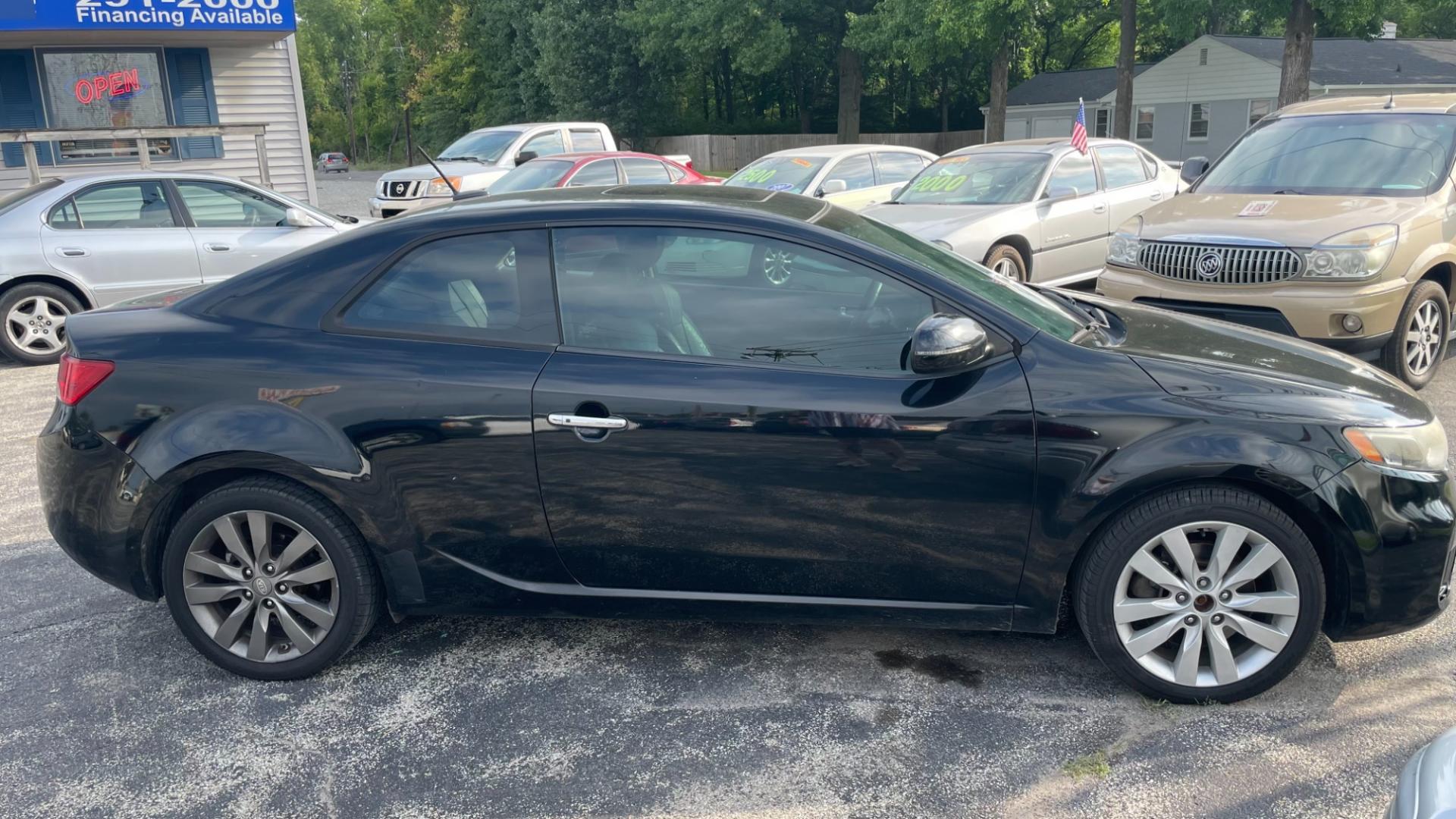 2011 /BLACK Kia Forte Koup SX (KNAFW6A36B5) with an 2.4L L4 DOHC 16V engine, located at 2710A Westlane Rd., Indianapolis, IN, 46268, (317) 291-2000, 39.885670, -86.208160 - Photo#3