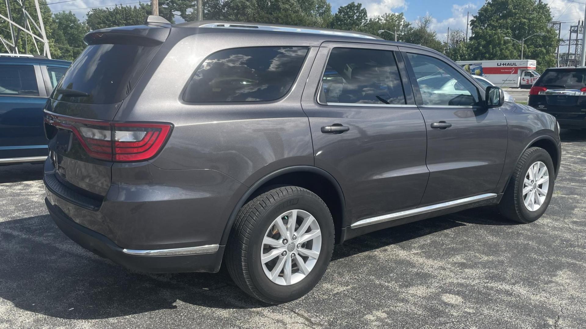 2014 Dodge Durango SXT (1C4RDJAG7EC) with an 3.6L V6 DOHC 24V engine, 8 SPEED AUTOMATIC transmission, located at 2710A Westlane Rd., Indianapolis, IN, 46268, (317) 291-2000, 39.885670, -86.208160 - ALL WHEEL DRIVE 7 PASSENGER SEATING REAR TEMPERATURE CONTROLS PUSH START TOUCH SCREEN RADIO - Photo#1