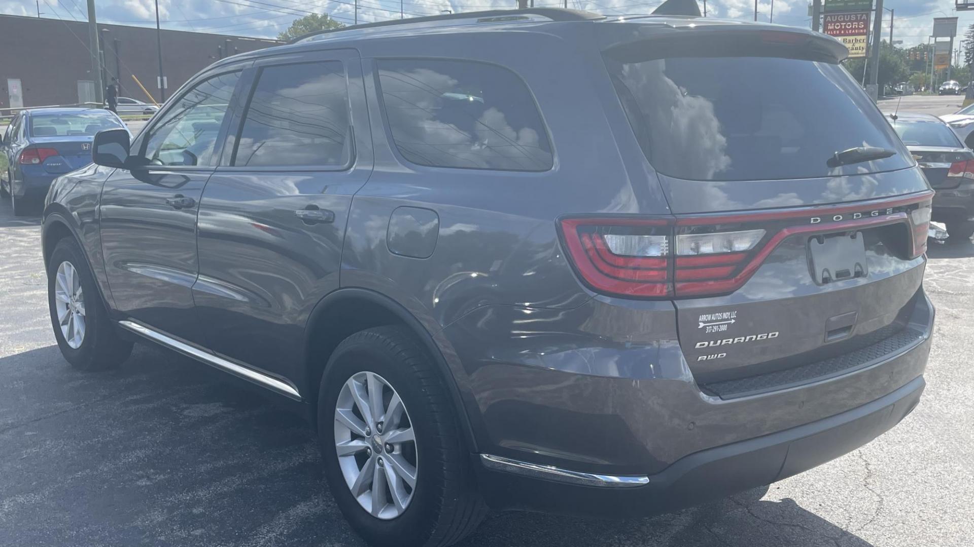 2014 Dodge Durango SXT (1C4RDJAG7EC) with an 3.6L V6 DOHC 24V engine, 8 SPEED AUTOMATIC transmission, located at 2710A Westlane Rd., Indianapolis, IN, 46268, (317) 291-2000, 39.885670, -86.208160 - ALL WHEEL DRIVE 7 PASSENGER SEATING REAR TEMPERATURE CONTROLS PUSH START TOUCH SCREEN RADIO - Photo#6