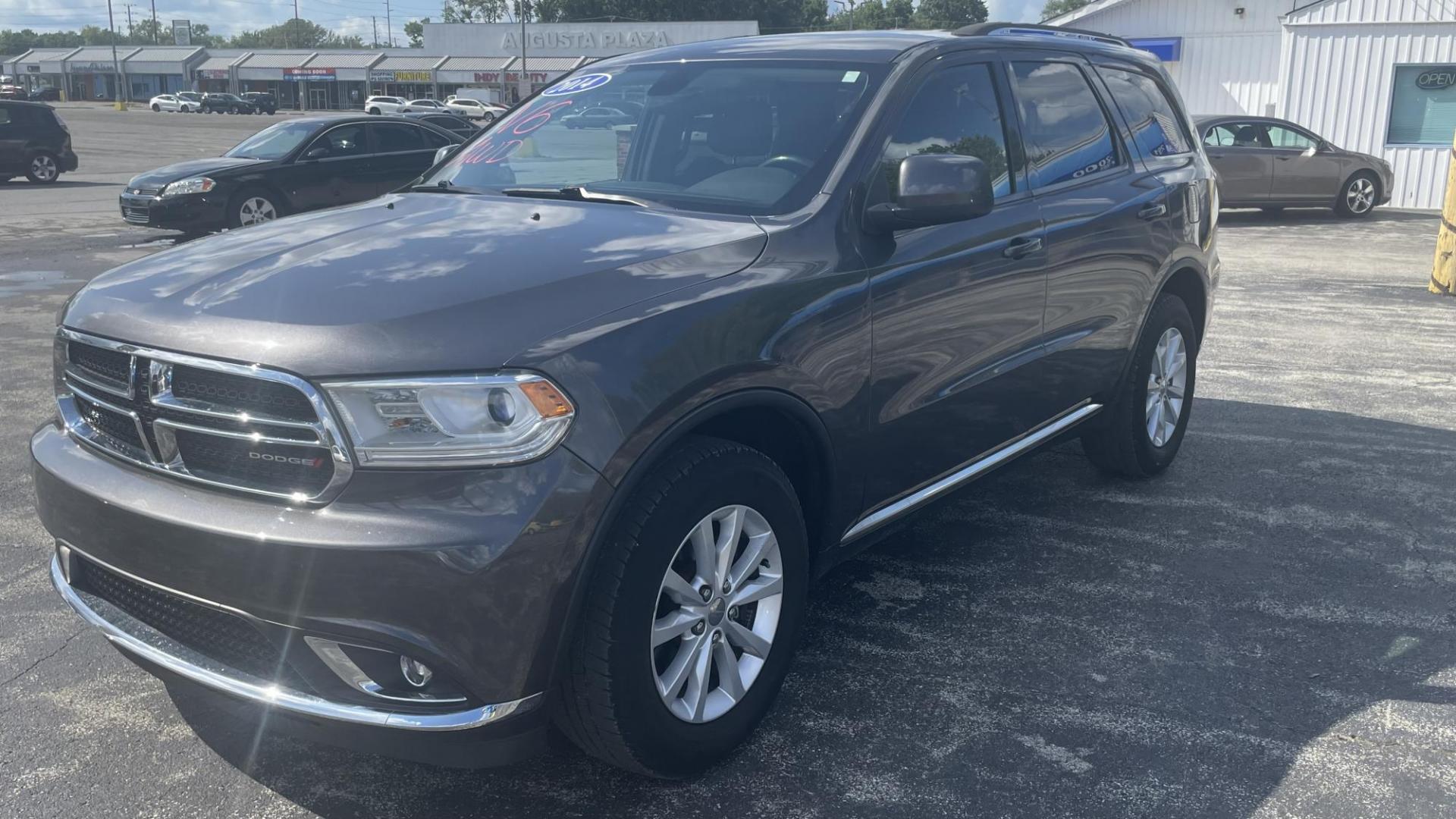 2014 Dodge Durango SXT (1C4RDJAG7EC) with an 3.6L V6 DOHC 24V engine, 8 SPEED AUTOMATIC transmission, located at 2710A Westlane Rd., Indianapolis, IN, 46268, (317) 291-2000, 39.885670, -86.208160 - ALL WHEEL DRIVE 7 PASSENGER SEATING REAR TEMPERATURE CONTROLS PUSH START TOUCH SCREEN RADIO - Photo#0