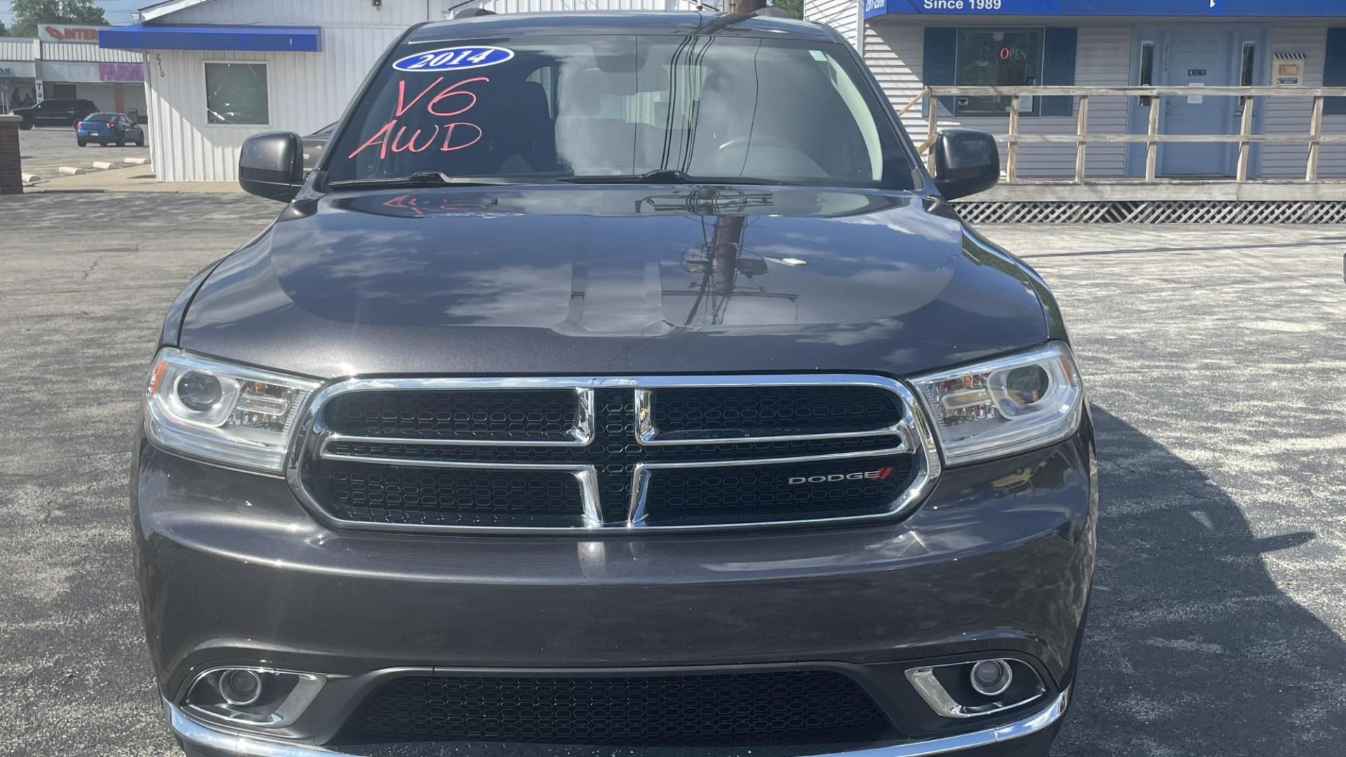 2014 Dodge Durango SXT (1C4RDJAG7EC) with an 3.6L V6 DOHC 24V engine, 8 SPEED AUTOMATIC transmission, located at 2710A Westlane Rd., Indianapolis, IN, 46268, (317) 291-2000, 39.885670, -86.208160 - ALL WHEEL DRIVE 7 PASSENGER SEATING REAR TEMPERATURE CONTROLS PUSH START TOUCH SCREEN RADIO - Photo#4