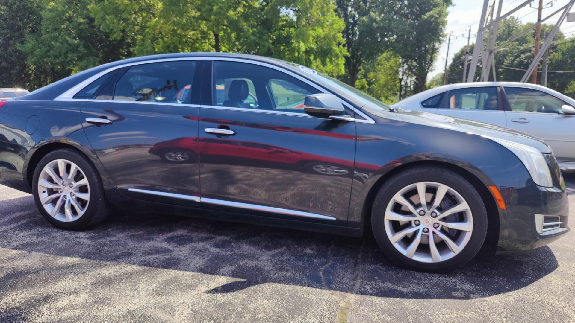 2015 BLACK /TAN / BLACK Cadillac XTS XTS (2G61N5S35F9) with an 3.6L V6 DOHC 24V engine, 6-Speed Automatic transmission, located at 2710A Westlane Rd., Indianapolis, IN, 46268, (317) 291-2000, 39.885670, -86.208160 - Alarm System Bluetooth Streaming Audio Bluetooth Wireless Technology Cruise Control Dual Power Front Seats Folding Rear Seat Hands Free Phone Heated Rear Seats Heated Seats Heated Steering Wheel Integrated Garage Door Opener Internet Access Leather Seats Leather-Wrapped Steering Wheel - Photo#3