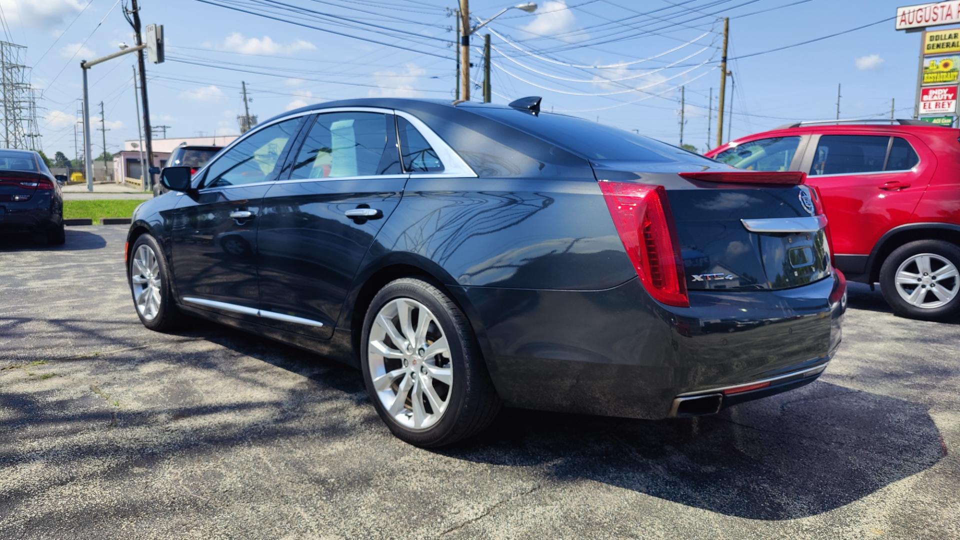 2015 BLACK /TAN / BLACK Cadillac XTS XTS (2G61N5S35F9) with an 3.6L V6 DOHC 24V engine, 6-Speed Automatic transmission, located at 2710A Westlane Rd., Indianapolis, IN, 46268, (317) 291-2000, 39.885670, -86.208160 - Alarm System Bluetooth Streaming Audio Bluetooth Wireless Technology Cruise Control Dual Power Front Seats Folding Rear Seat Hands Free Phone Heated Rear Seats Heated Seats Heated Steering Wheel Integrated Garage Door Opener Internet Access Leather Seats Leather-Wrapped Steering Wheel - Photo#2