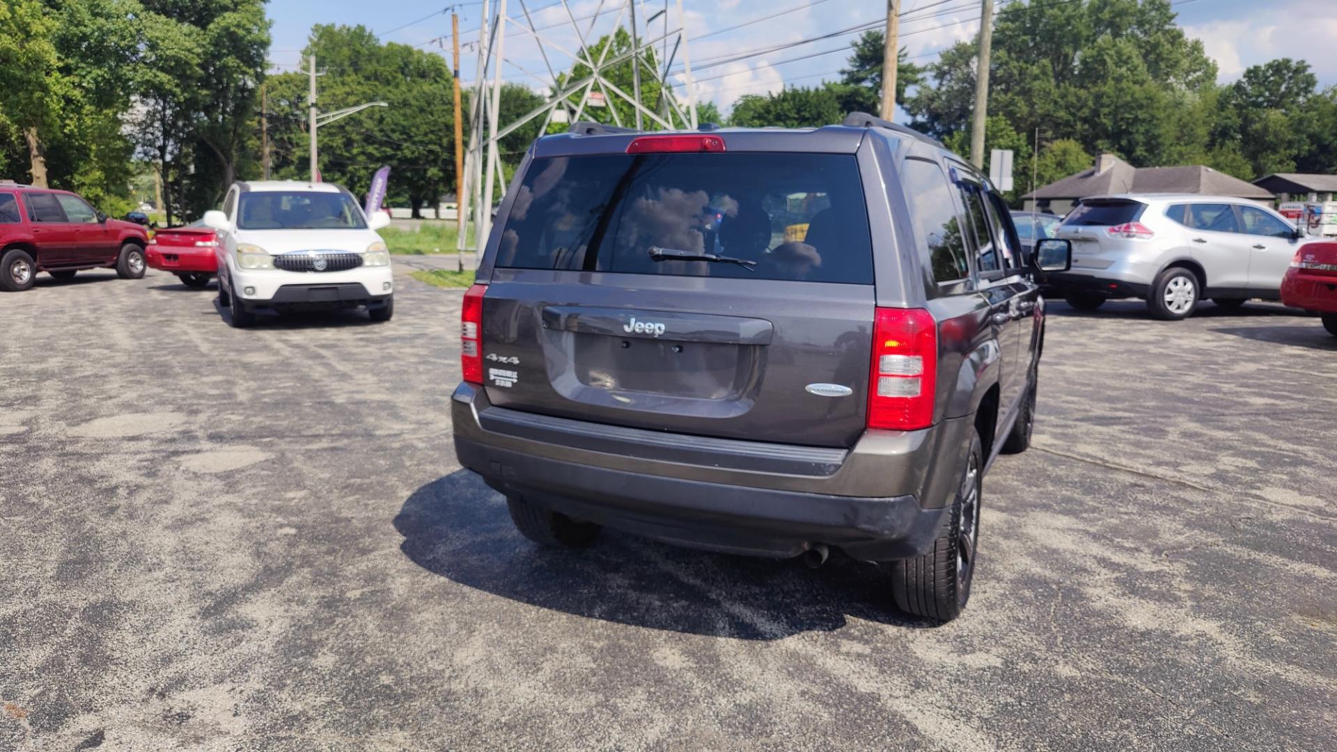 2014 GRAY /BLACK Jeep Patriot LATITUDE (1C4NJRFBXED) with an 2.4L L4 DOHC 16V engine, 6-Speed Automatic transmission, located at 2710A Westlane Rd., Indianapolis, IN, 46268, (317) 291-2000, 39.885670, -86.208160 - Photo#4