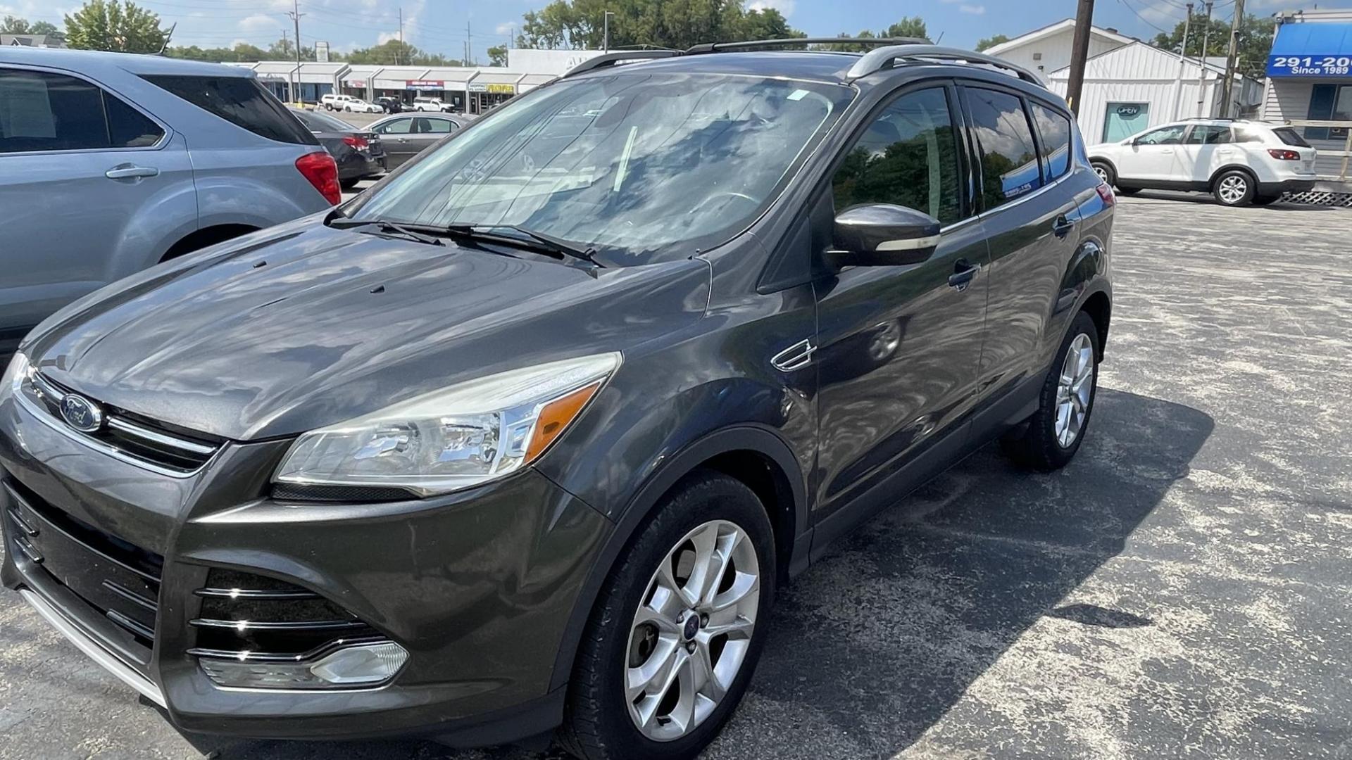 2016 Ford Escape Titanium 4WD (1FMCU9J97GU) with an 2.0L L4 DOHC 16V engine, 6-Speed Automatic transmission, located at 2710A Westlane Rd., Indianapolis, IN, 46268, (317) 291-2000, 39.885670, -86.208160 - Photo#0