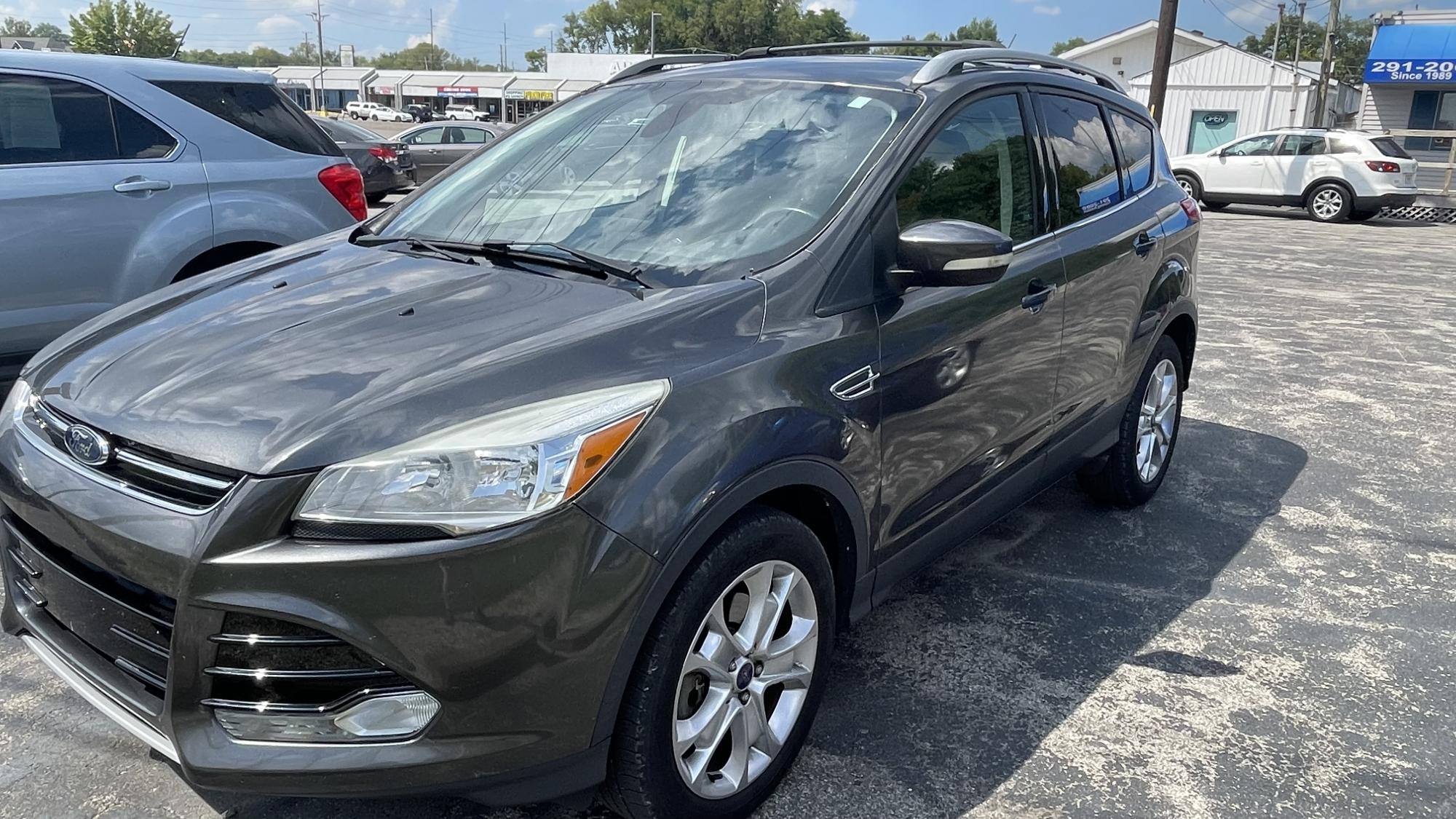 photo of 2016 Ford Escape Titanium 4WD / OUTSIDE FINANCING / WARRANTY, GAP COVERAGE, ROADSIDE ASSISTANCE AVAILABLE