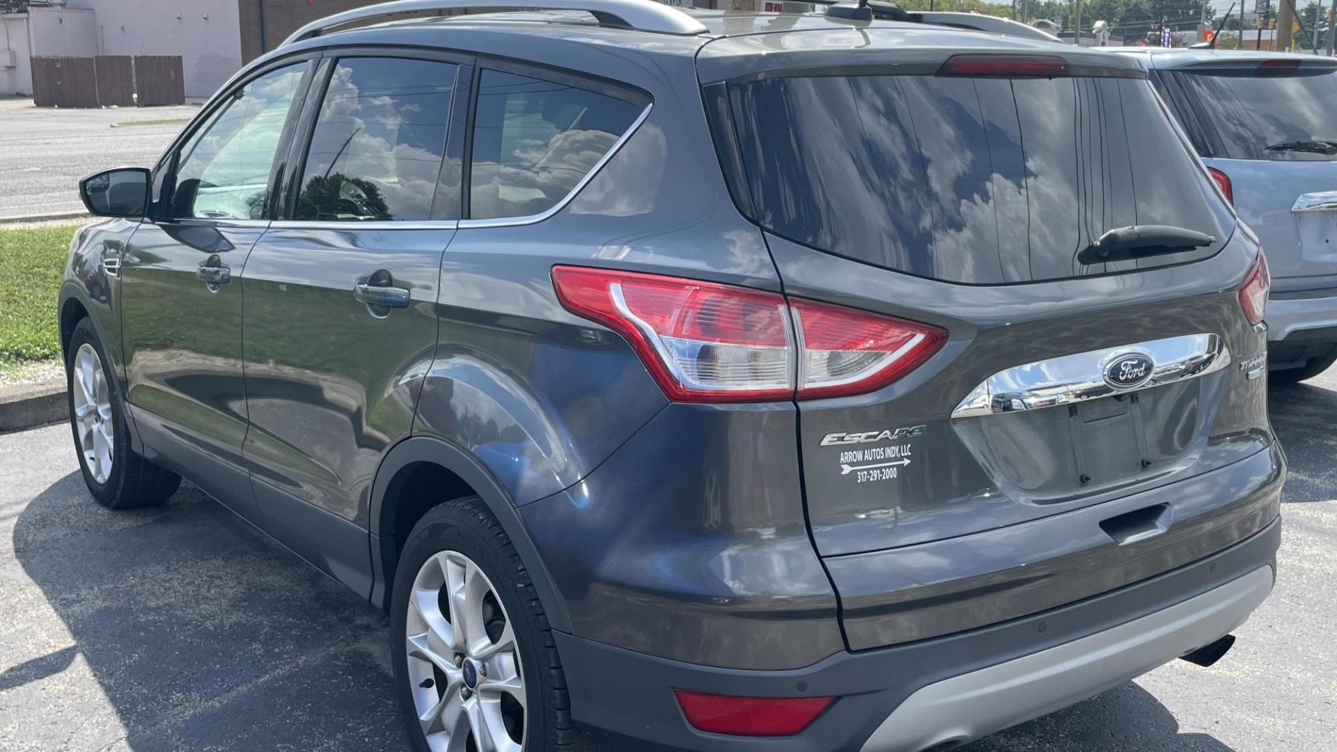 2016 Ford Escape Titanium 4WD (1FMCU9J97GU) with an 2.0L L4 DOHC 16V engine, 6-Speed Automatic transmission, located at 2710A Westlane Rd., Indianapolis, IN, 46268, (317) 291-2000, 39.885670, -86.208160 - Photo#4