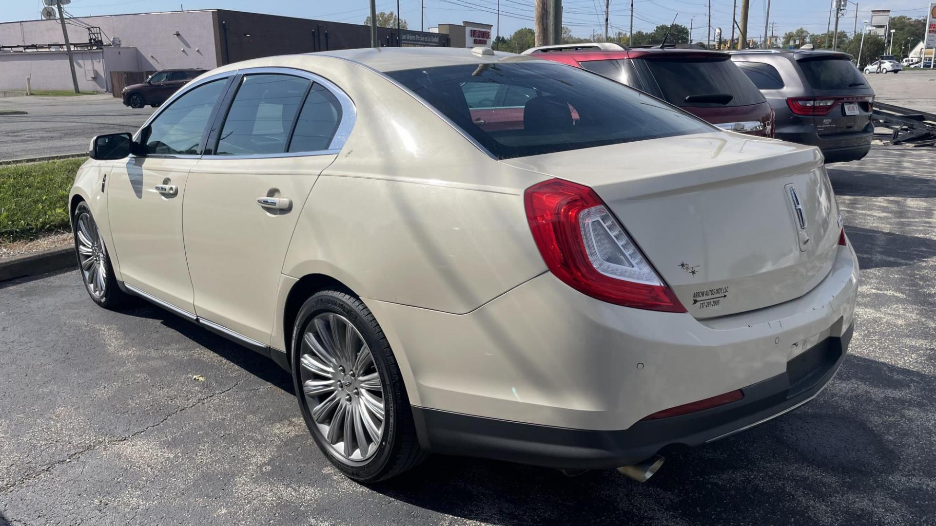 2014 CREAM /BLACK Lincoln MKS FWD (1LNHL9DK4EG) with an 3.5L V6 DOHC 24V engine, 6-Speed Automatic transmission, located at 2710A Westlane Rd., Indianapolis, IN, 46268, (317) 291-2000, 39.885670, -86.208160 - Photo#5