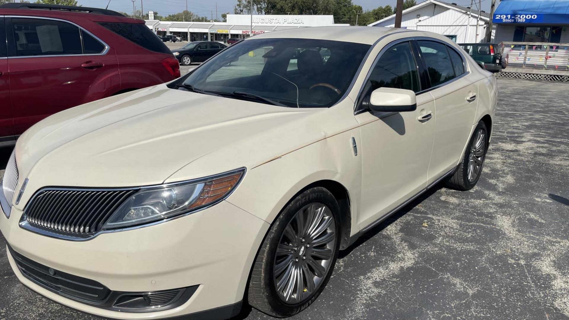 2014 CREAM /BLACK Lincoln MKS FWD (1LNHL9DK4EG) with an 3.5L V6 DOHC 24V engine, 6-Speed Automatic transmission, located at 2710A Westlane Rd., Indianapolis, IN, 46268, (317) 291-2000, 39.885670, -86.208160 - Photo#0