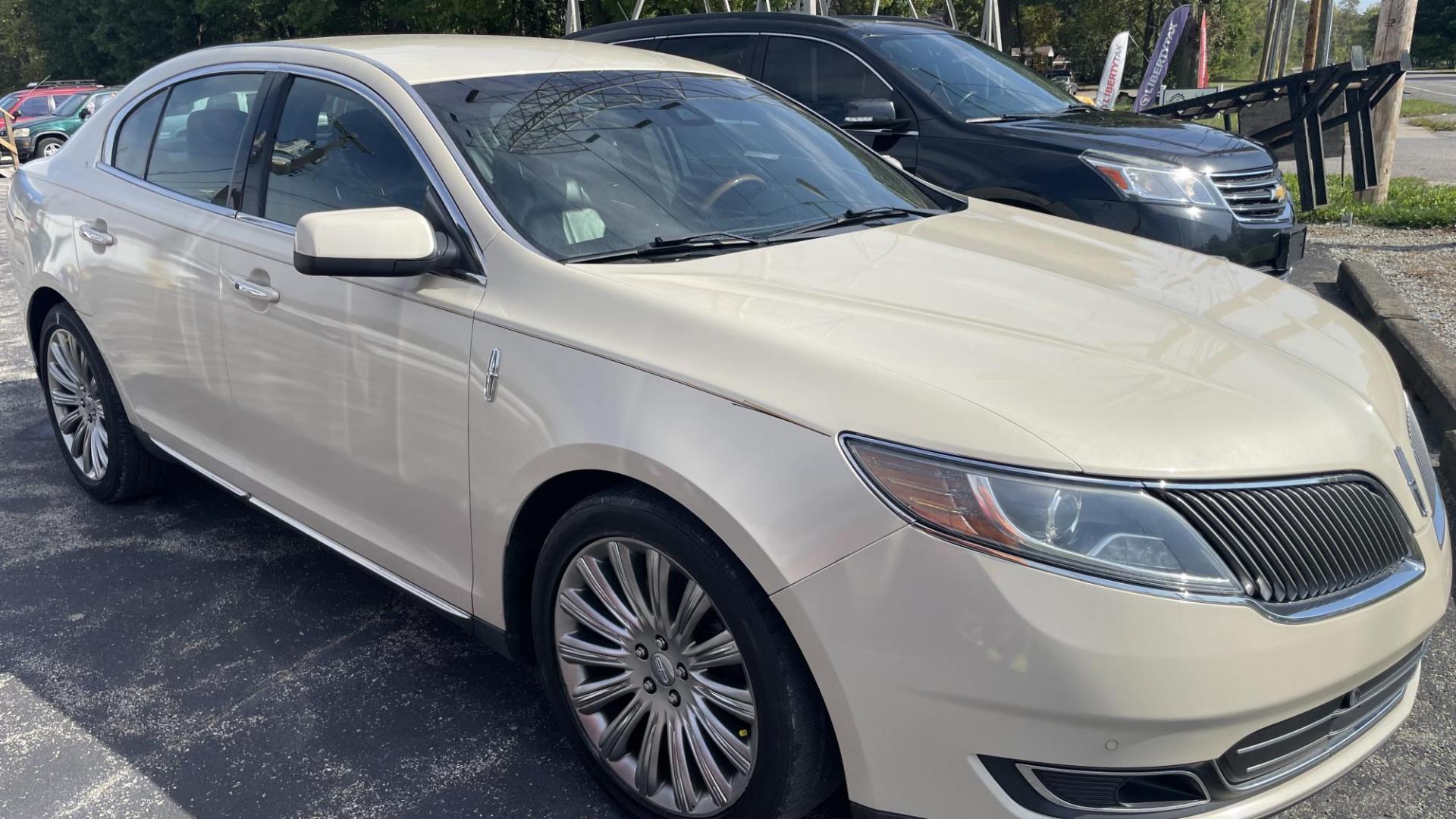 2014 CREAM /BLACK Lincoln MKS FWD (1LNHL9DK4EG) with an 3.5L V6 DOHC 24V engine, 6-Speed Automatic transmission, located at 2710A Westlane Rd., Indianapolis, IN, 46268, (317) 291-2000, 39.885670, -86.208160 - Photo#1