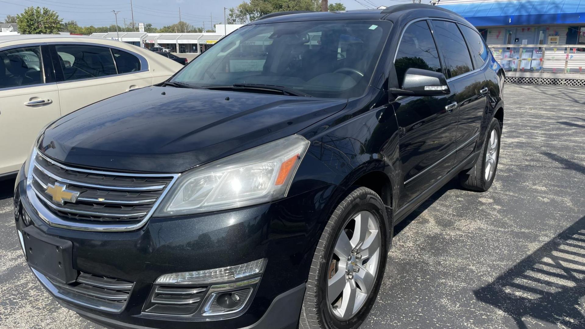 2014 BLACK /BLACK Chevrolet Traverse LTZ AWD (1GNKVJKD9EJ) with an 3.6L V6 DOHC 24V engine, 6-Speed Automatic transmission, located at 2710A Westlane Rd., Indianapolis, IN, 46268, (317) 291-2000, 39.885670, -86.208160 - Photo#0