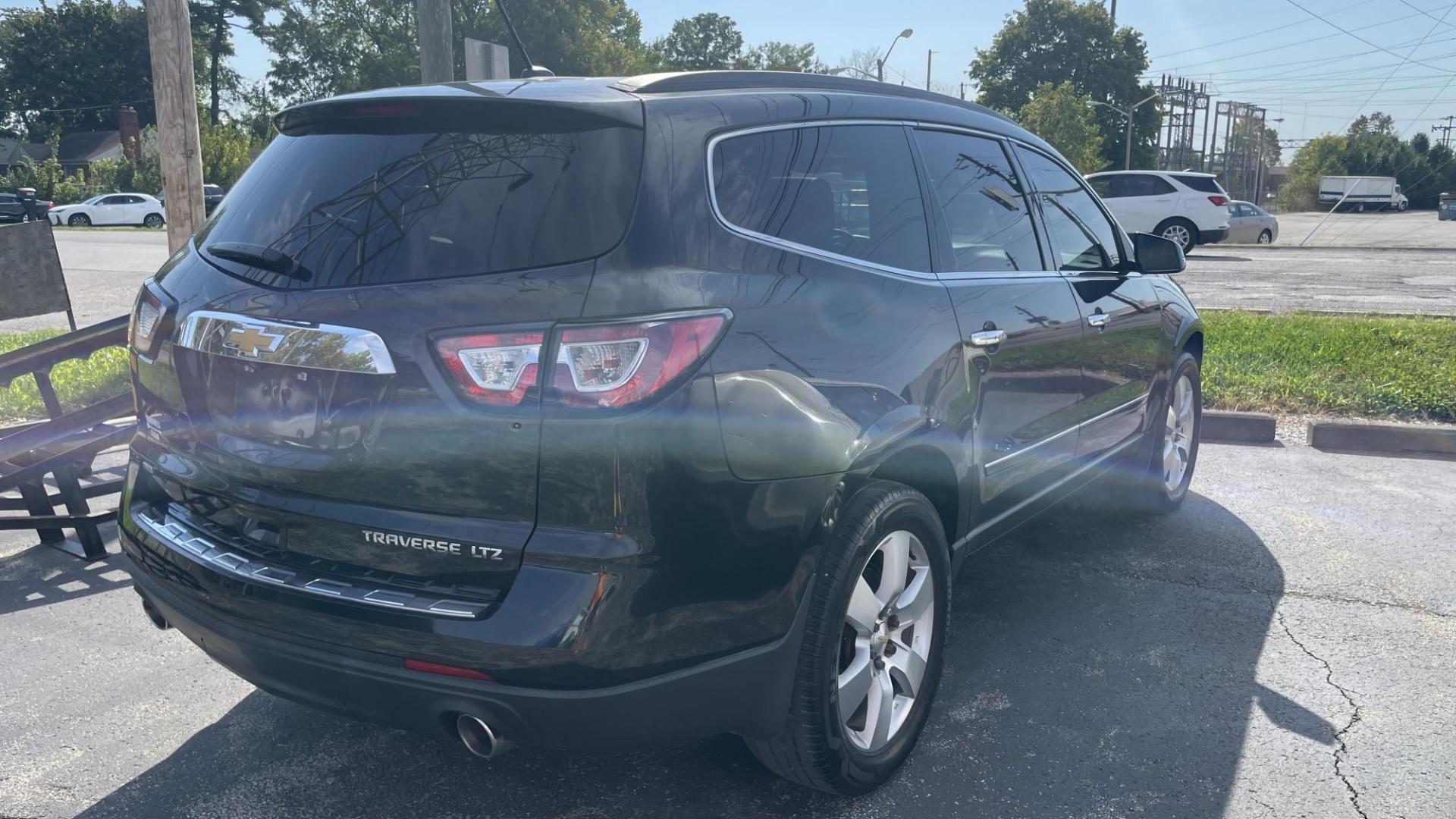 2014 BLACK /BLACK Chevrolet Traverse LTZ AWD (1GNKVJKD9EJ) with an 3.6L V6 DOHC 24V engine, 6-Speed Automatic transmission, located at 2710A Westlane Rd., Indianapolis, IN, 46268, (317) 291-2000, 39.885670, -86.208160 - Photo#3