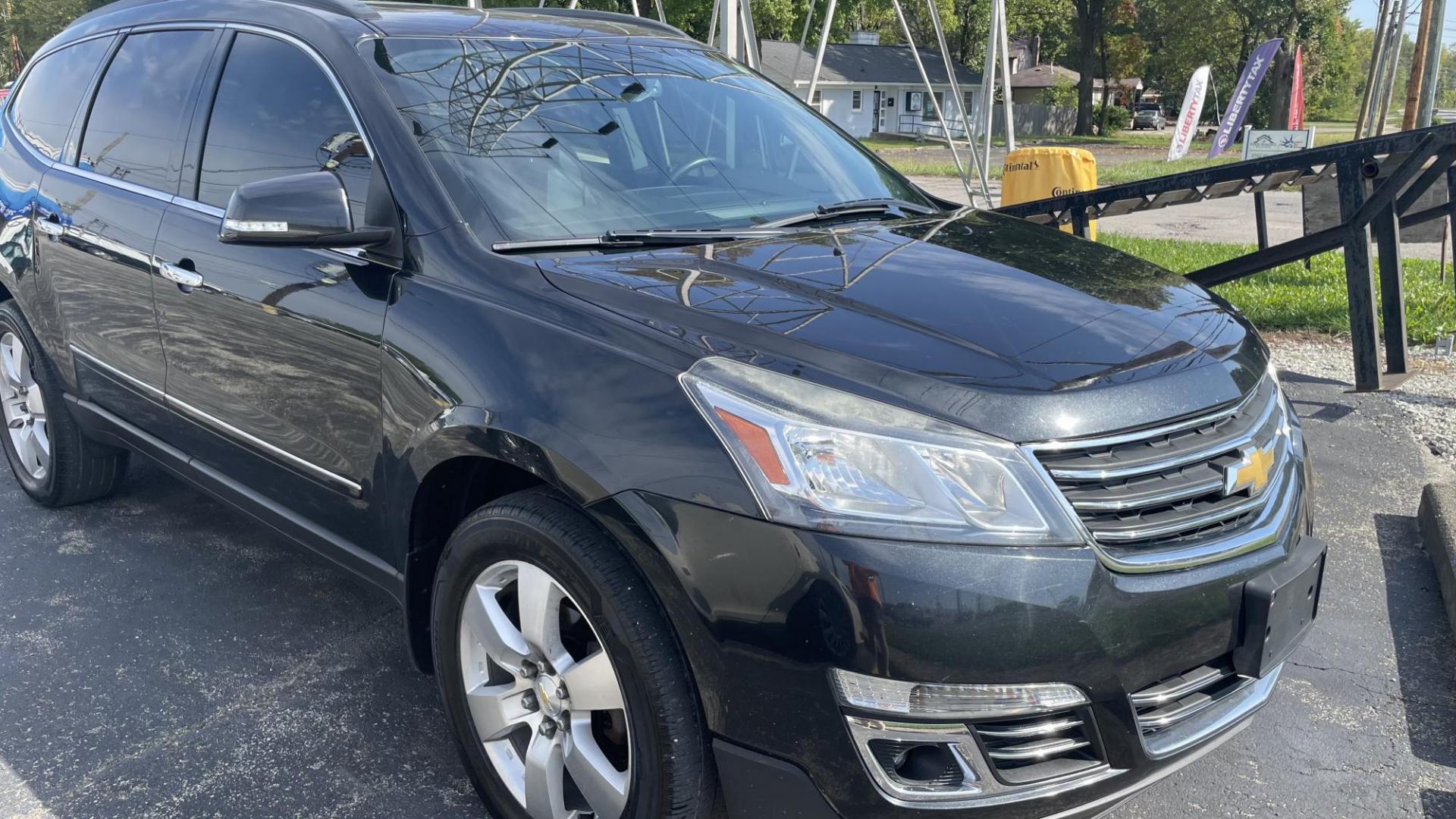 2014 BLACK /BLACK Chevrolet Traverse LTZ AWD (1GNKVJKD9EJ) with an 3.6L V6 DOHC 24V engine, 6-Speed Automatic transmission, located at 2710A Westlane Rd., Indianapolis, IN, 46268, (317) 291-2000, 39.885670, -86.208160 - Photo#1