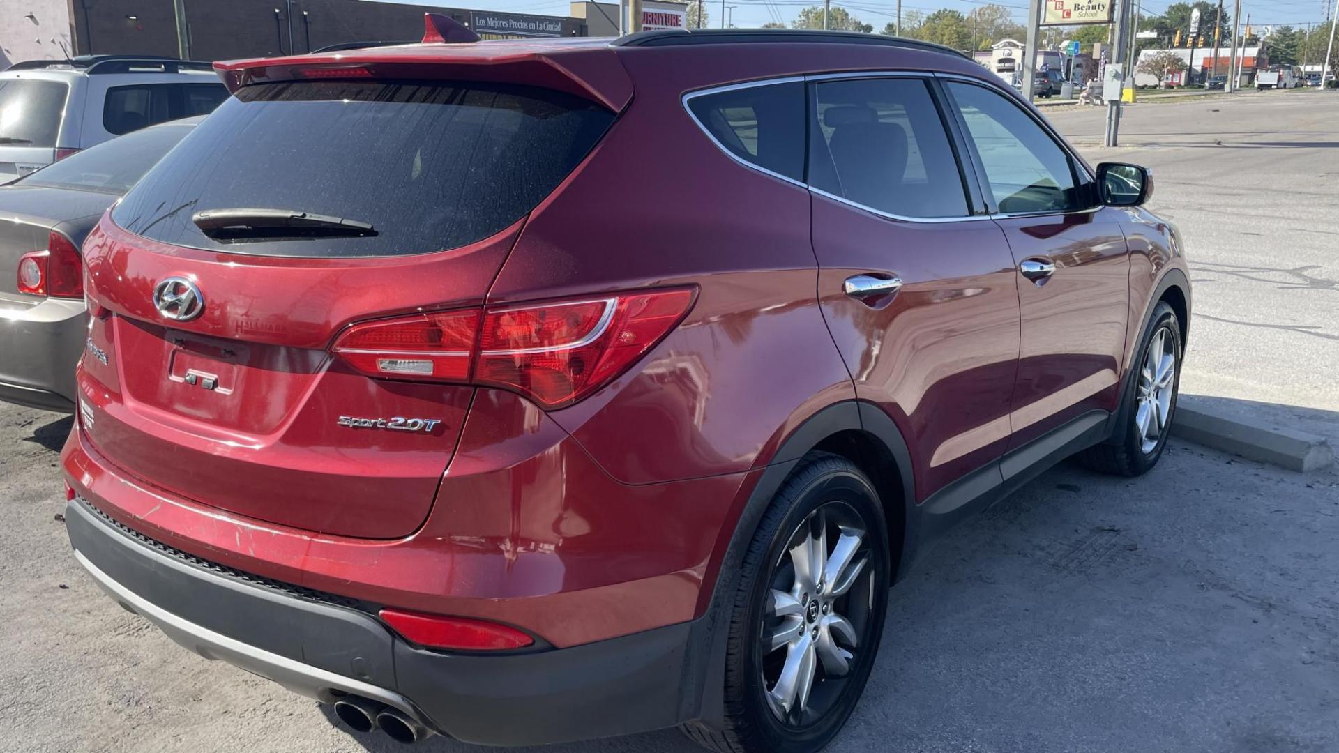 2013 MAROON Hyundai Santa Fe Sport 2.0 FWD (5XYZU3LAXDG) with an 2.0L L4 DOHC 16V engine, 6-Speed Automatic transmission, located at 2710A Westlane Rd., Indianapolis, IN, 46268, (317) 291-2000, 39.885670, -86.208160 - Photo#4