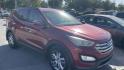 2013 MAROON Hyundai Santa Fe Sport 2.0 FWD (5XYZU3LAXDG) with an 2.0L L4 DOHC 16V engine, 6-Speed Automatic transmission, located at 2710A Westlane Rd., Indianapolis, IN, 46268, (317) 291-2000, 39.885670, -86.208160 - Photo#1