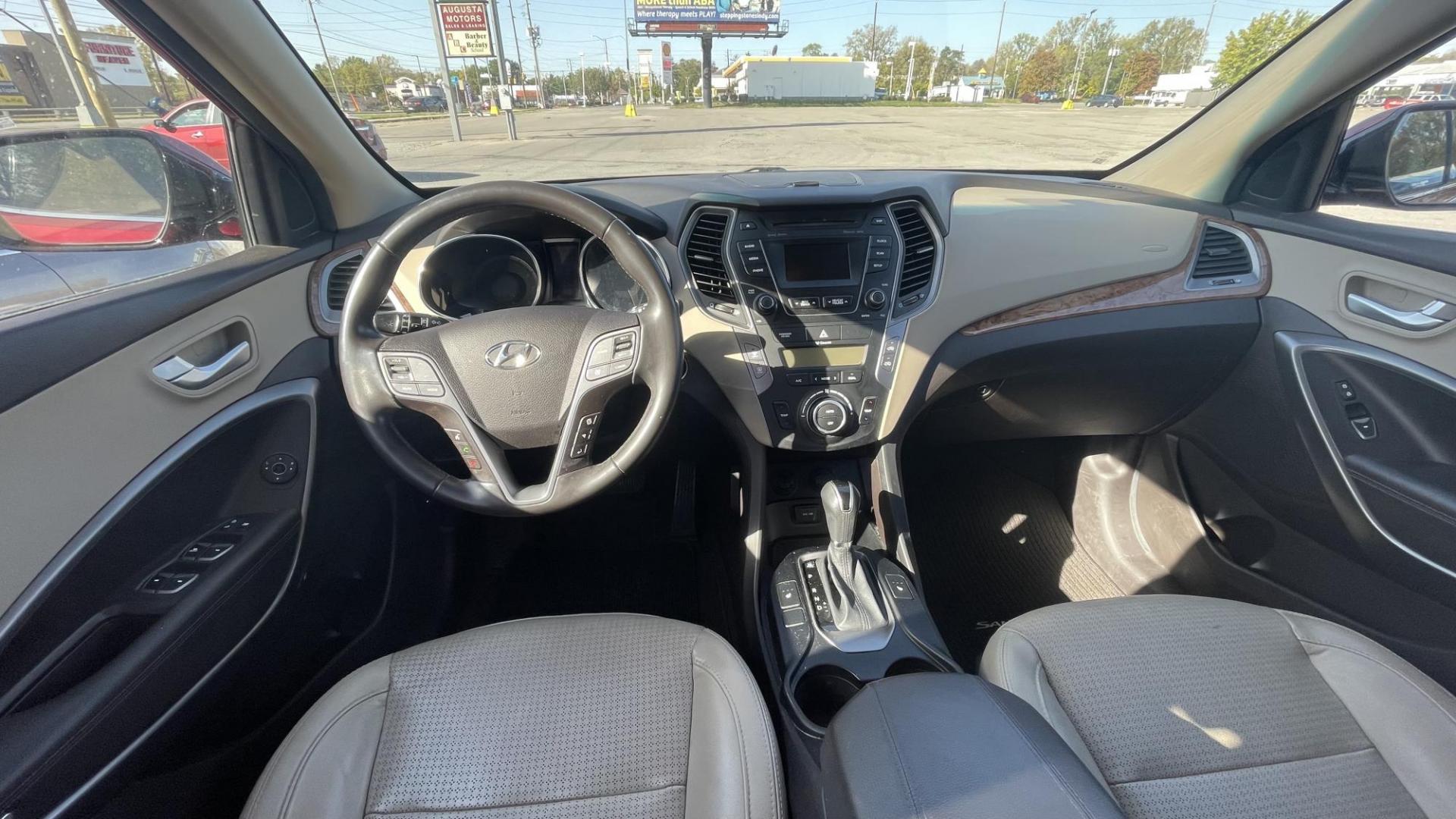 2013 MAROON Hyundai Santa Fe Sport 2.0 FWD (5XYZU3LAXDG) with an 2.0L L4 DOHC 16V engine, 6-Speed Automatic transmission, located at 2710A Westlane Rd., Indianapolis, IN, 46268, (317) 291-2000, 39.885670, -86.208160 - Photo#6