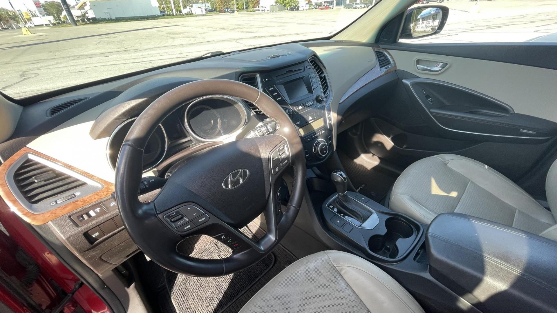 2013 MAROON Hyundai Santa Fe Sport 2.0 FWD (5XYZU3LAXDG) with an 2.0L L4 DOHC 16V engine, 6-Speed Automatic transmission, located at 2710A Westlane Rd., Indianapolis, IN, 46268, (317) 291-2000, 39.885670, -86.208160 - Photo#9