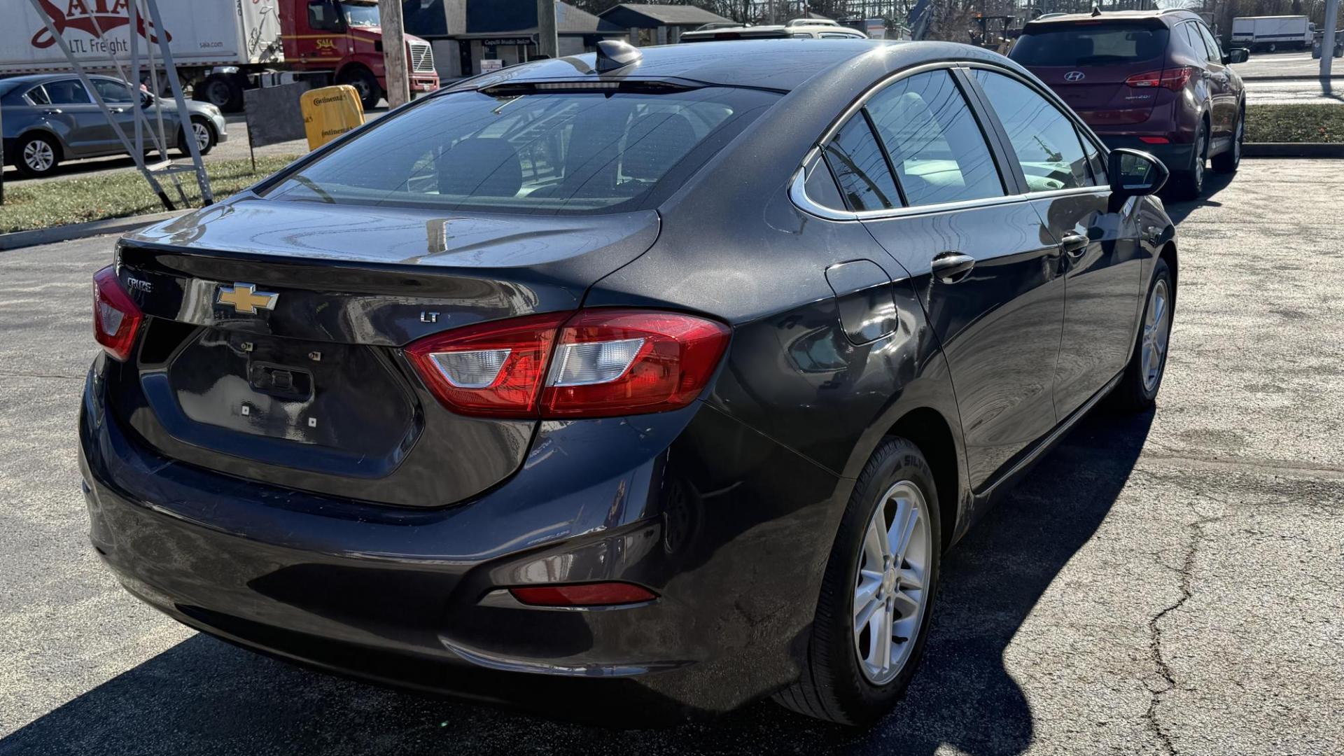 2017 GRAY Chevrolet Cruze LT Auto (1G1BE5SMXH7) with an 1.4L L4 DOHC 16V TURBO engine, 6A transmission, located at 2710A Westlane Rd., Indianapolis, IN, 46268, (317) 291-2000, 39.885670, -86.208160 - Photo#5