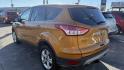 2016 ORANGE/COPPER /GRAY Ford Escape SE 4WD (1FMCU9GX1GU) with an 1.6L L4 DOHC 16V engine, 6-Speed Automatic transmission, located at 2710A Westlane Rd., Indianapolis, IN, 46268, (317) 291-2000, 39.885670, -86.208160 - Photo#7