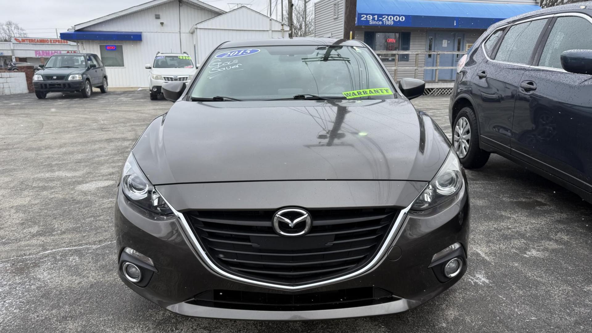 2015 DARK GRAY /GRAY Mazda MAZDA3 i Sport AT 4-Door (JM1BM1U77F1) with an 2.0L L4 DOHC 16V engine, 6-Speed Automatic transmission, located at 2710A Westlane Rd., Indianapolis, IN, 46268, (317) 291-2000, 39.885670, -86.208160 - Photo#2